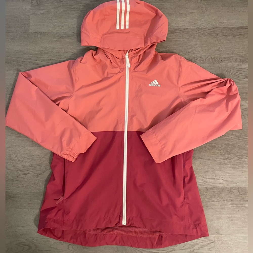 Never worn Adidas wind breaker/rain jacket Size L.